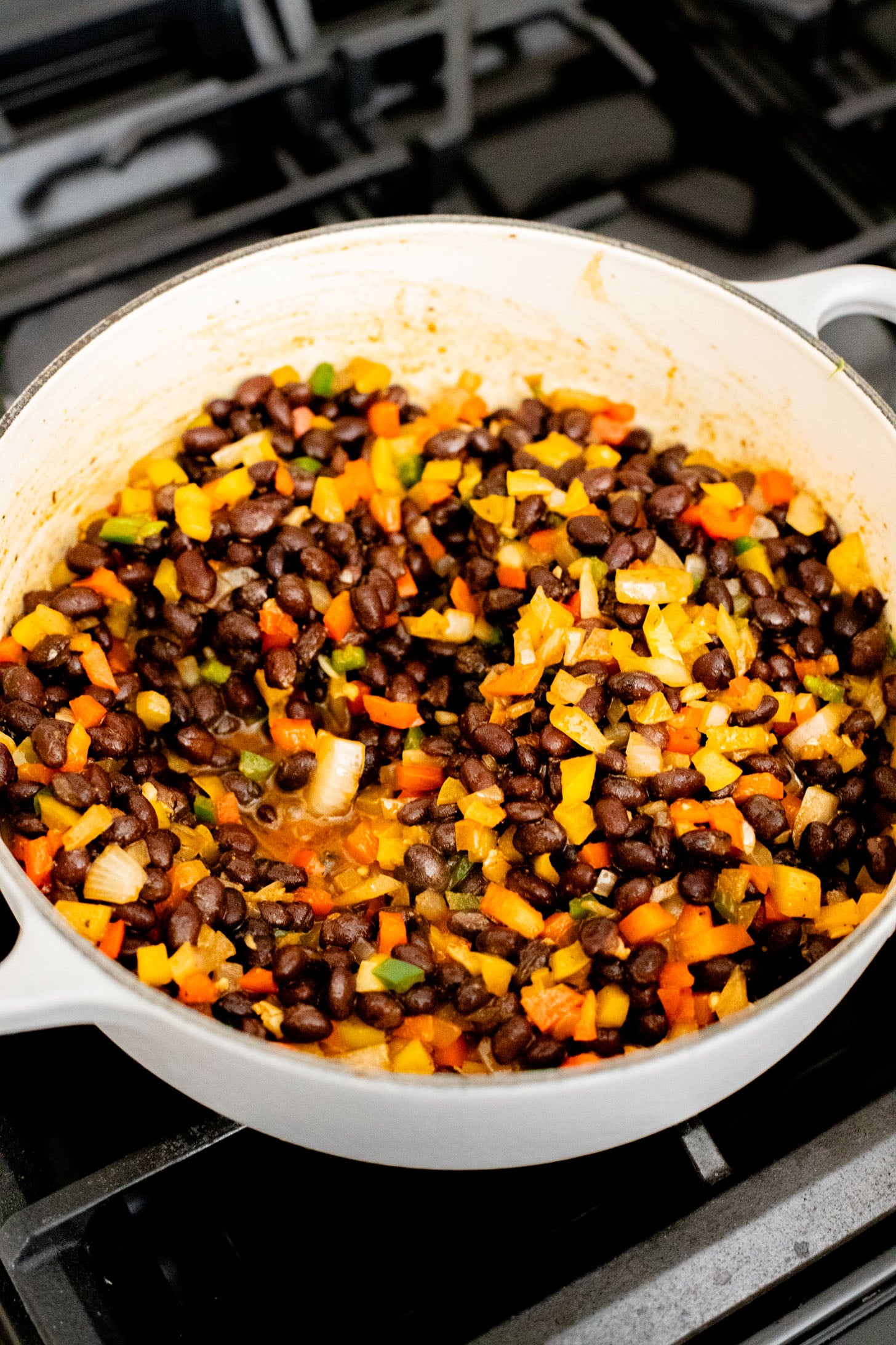 This High Protein Quinoa Enchilada Casserole is perfect for meal prep! Everything is cooked in one pot and each serving has 20+ grams of plant protein | ThisSavoryVegan.com
