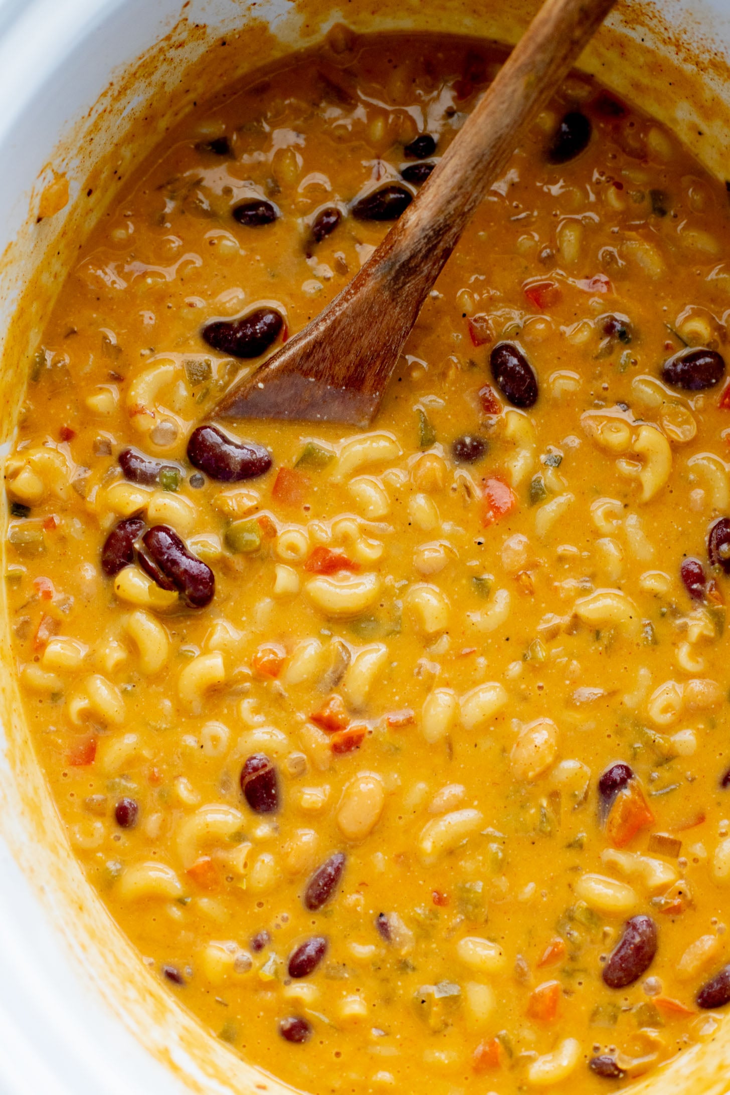 This Slow Cooker Vegan Chili Mac is the perfect weeknight dinner. Veggies, beans, pasta and a dairy-free cheesy sauce. Simply delicious | ThisSavoryVegan.com