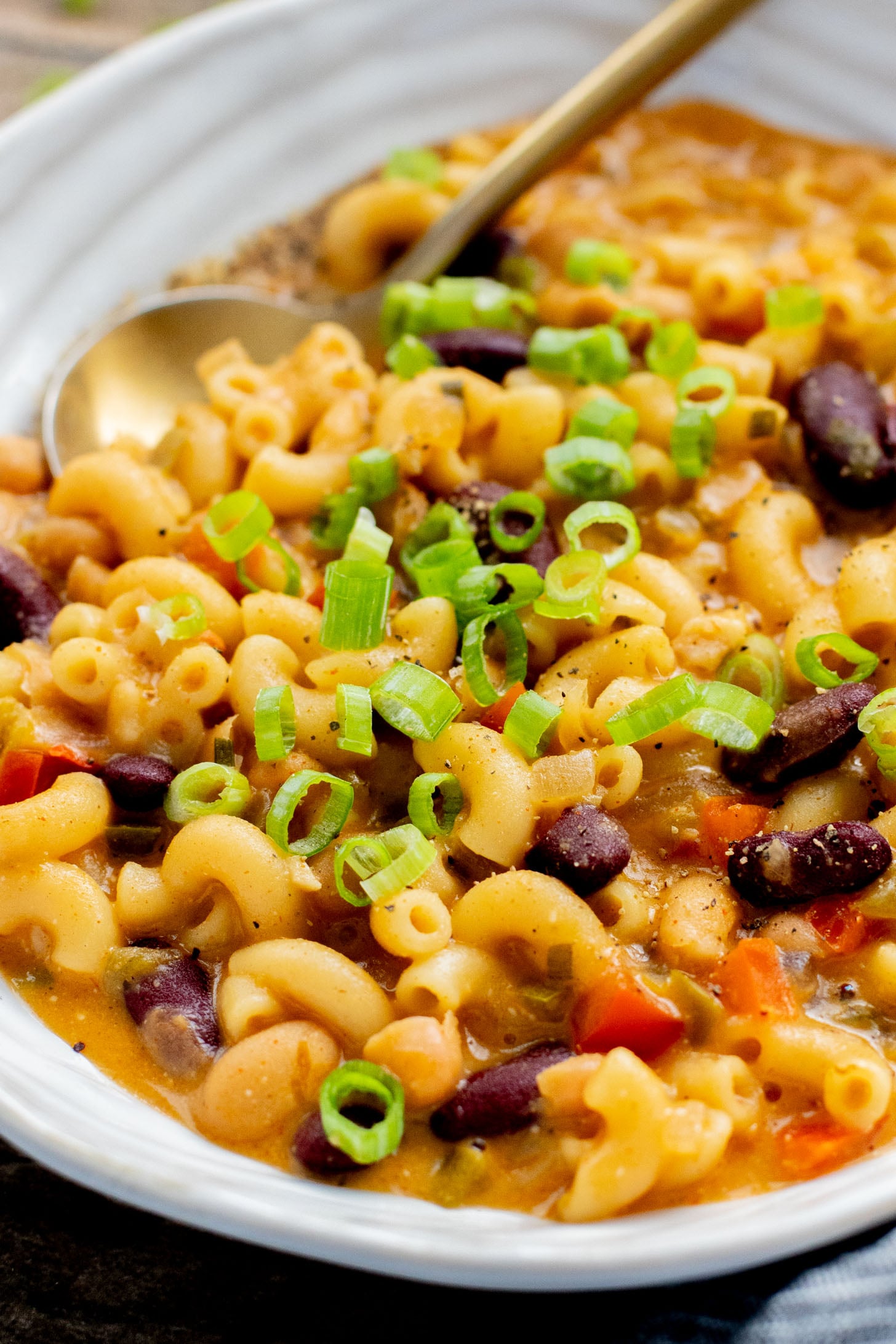 This Slow Cooker Vegan Chili Mac is the perfect weeknight dinner. Veggies, beans, pasta and a dairy-free cheesy sauce. Simply delicious | ThisSavoryVegan.com