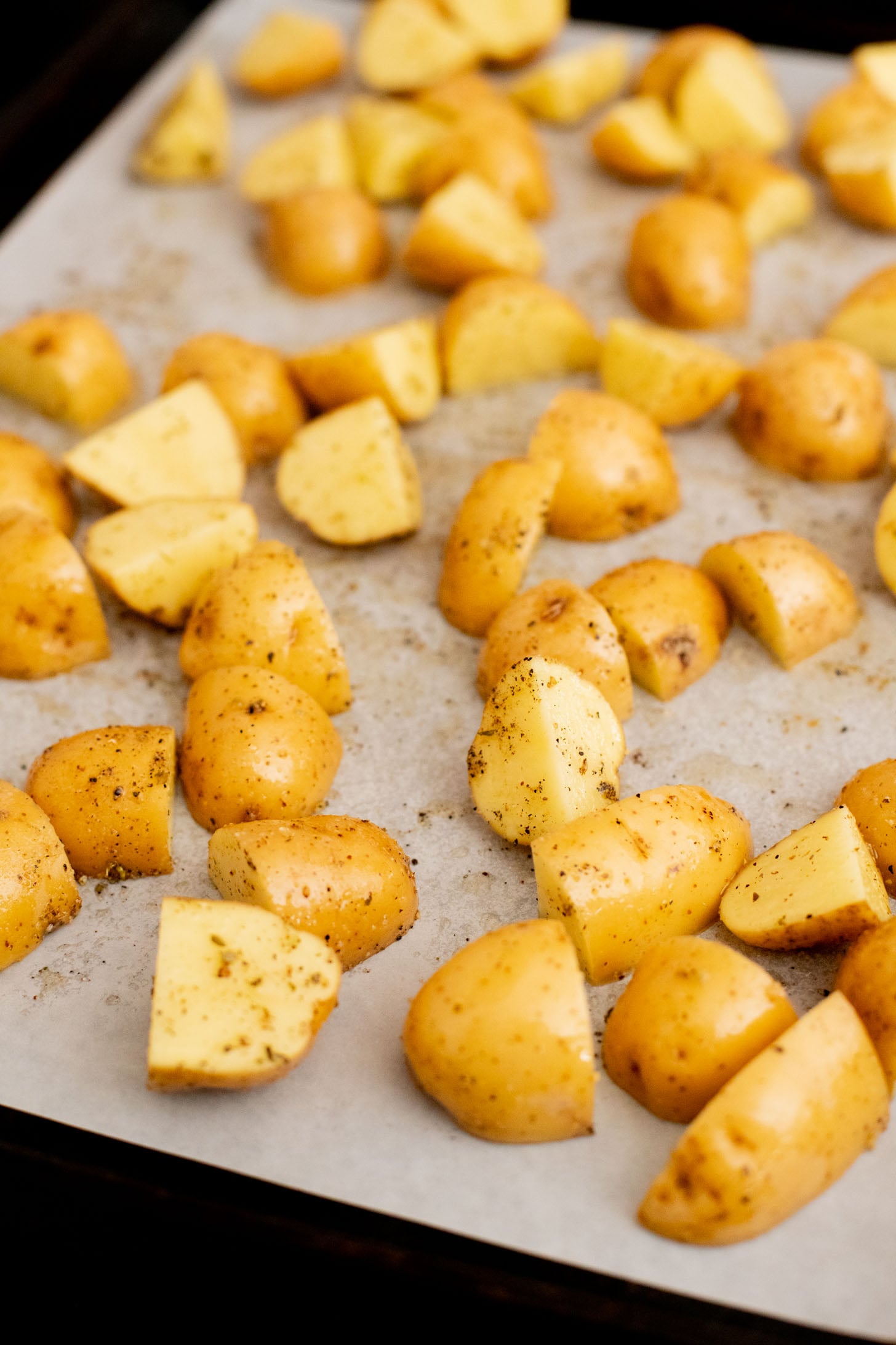 These Vegan Feta Potatoes are roasted to perfection with cherry tomatoes and topped with vegan feta, fresh herbs & lemon juice | ThisSavoryVegan.com