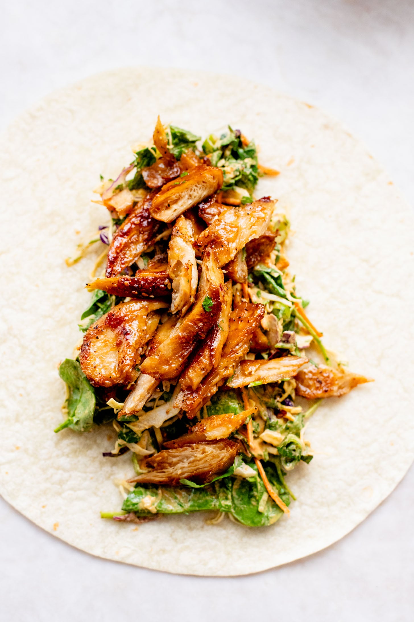 These Vegan Peanut Chicken Wraps are filled with crispy vegan chicken, crunchy veggies and the BEST spicy peanut sauce | ThisSavoryVegan.com