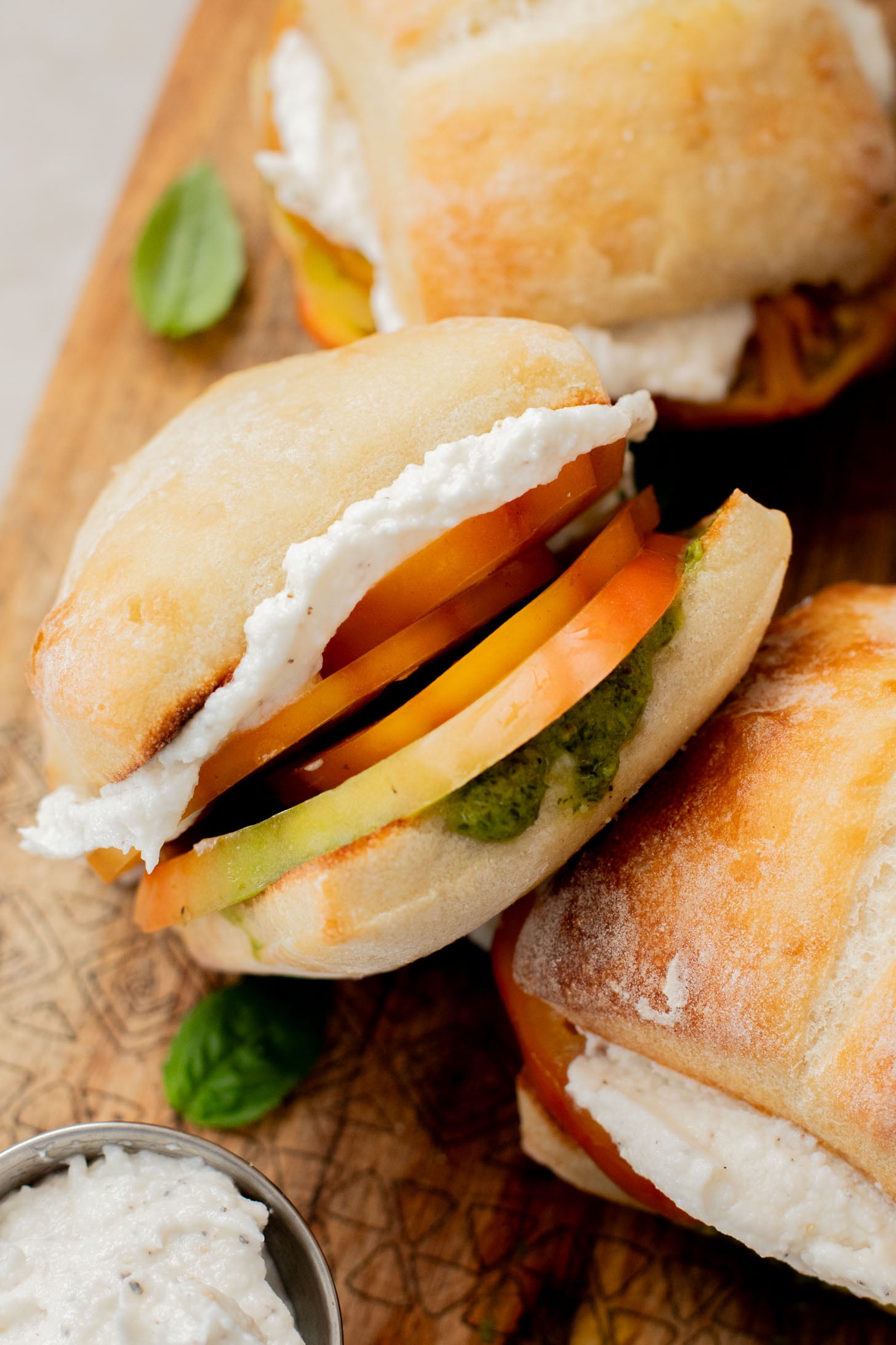 These Whipped Feta & Pesto Tomato Sandwiches are the perfect summer sammie! Made with dairy-free feta - the perfect way to use up summer tomatoes | ThisSavoryVegan.com
