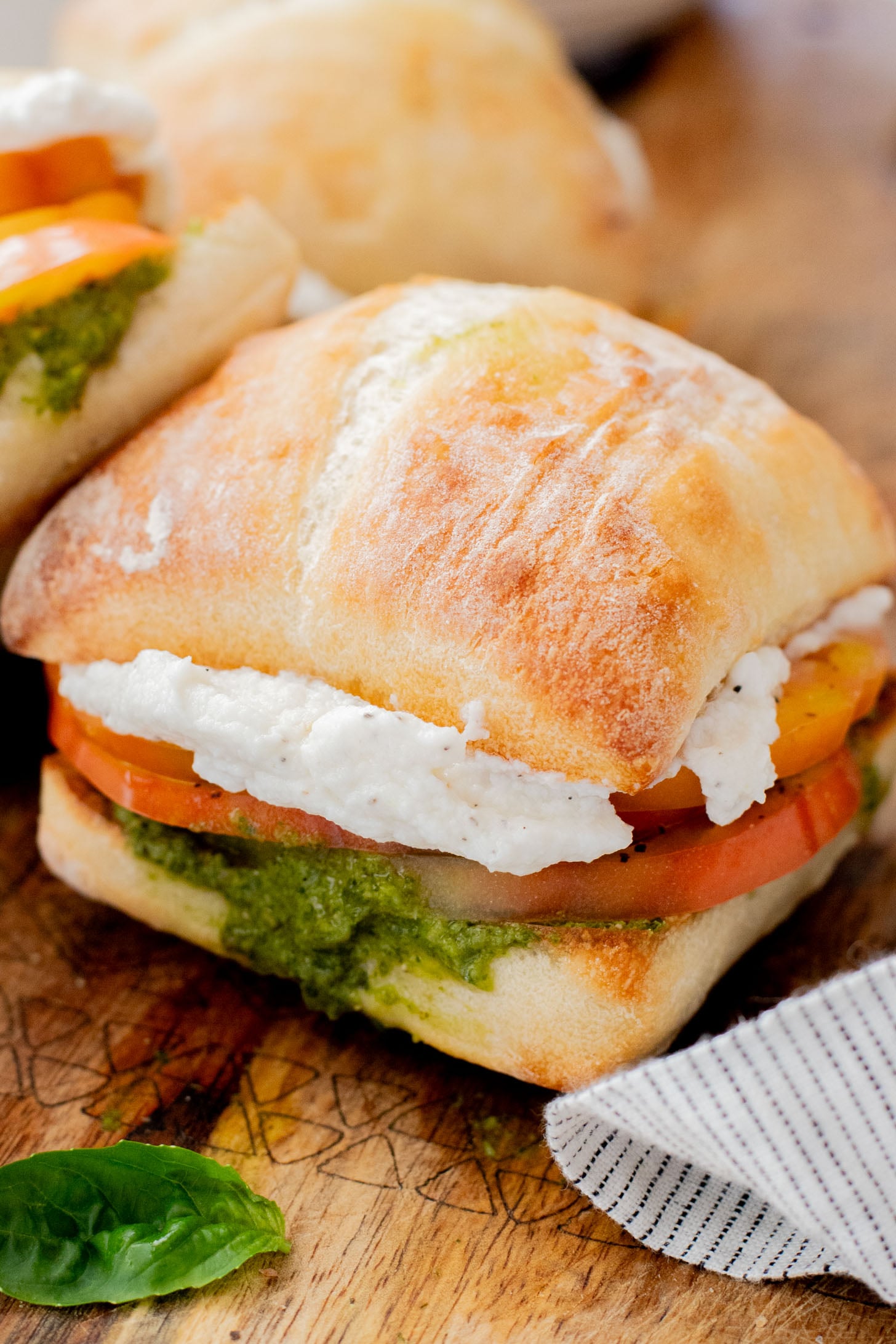 These Whipped Feta & Pesto Tomato Sandwiches are the perfect summer sammie! Made with dairy-free feta - the perfect way to use up summer tomatoes | ThisSavoryVegan.com