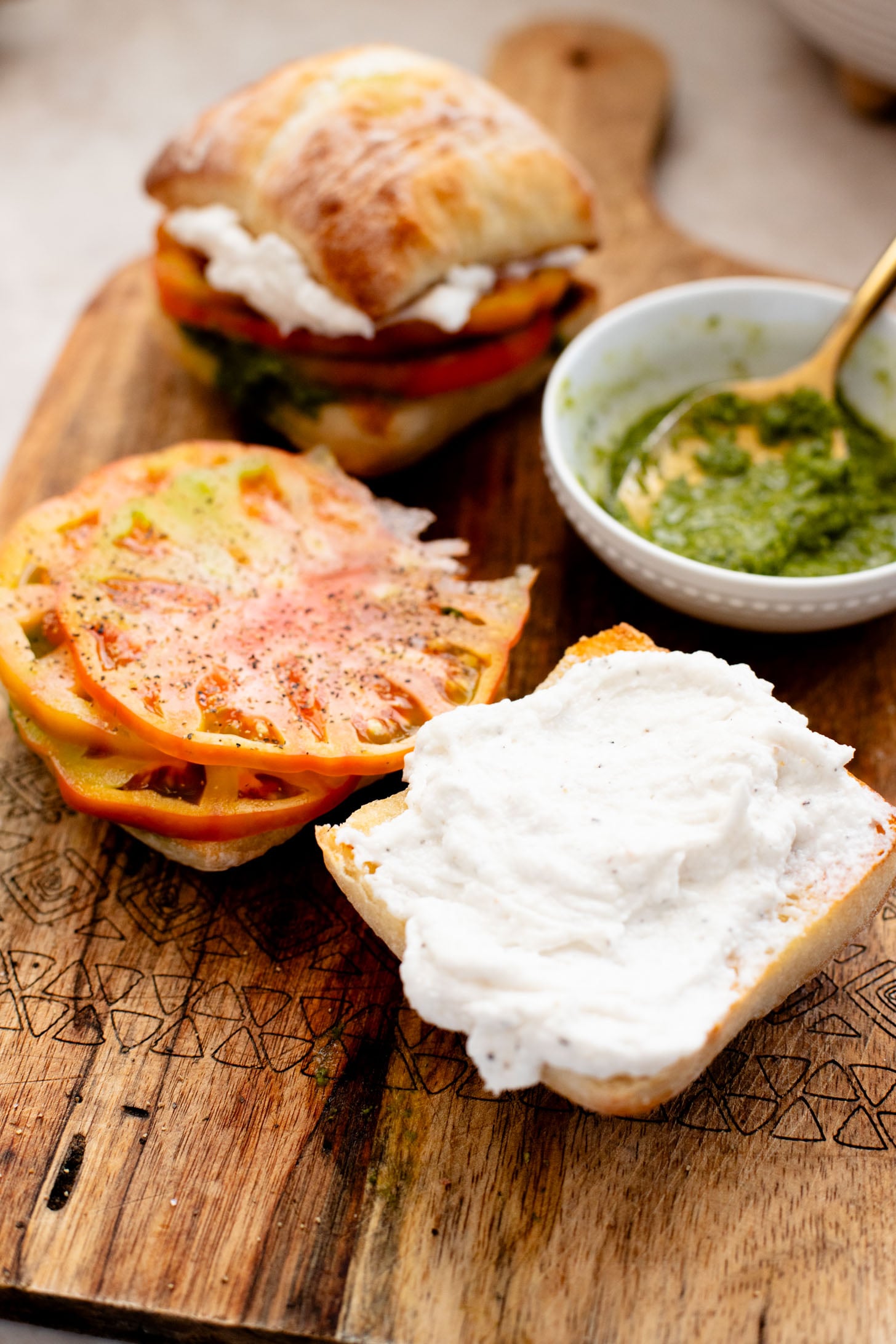 These Whipped Feta & Pesto Tomato Sandwiches are the perfect summer sammie! Made with dairy-free feta - the perfect way to use up summer tomatoes | ThisSavoryVegan.com