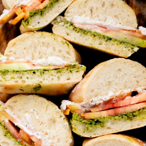 These Whipped Feta & Pesto Tomato Sandwiches are the perfect summer sammie! Made with dairy-free feta - the perfect way to use up summer tomatoes | ThisSavoryVegan.com