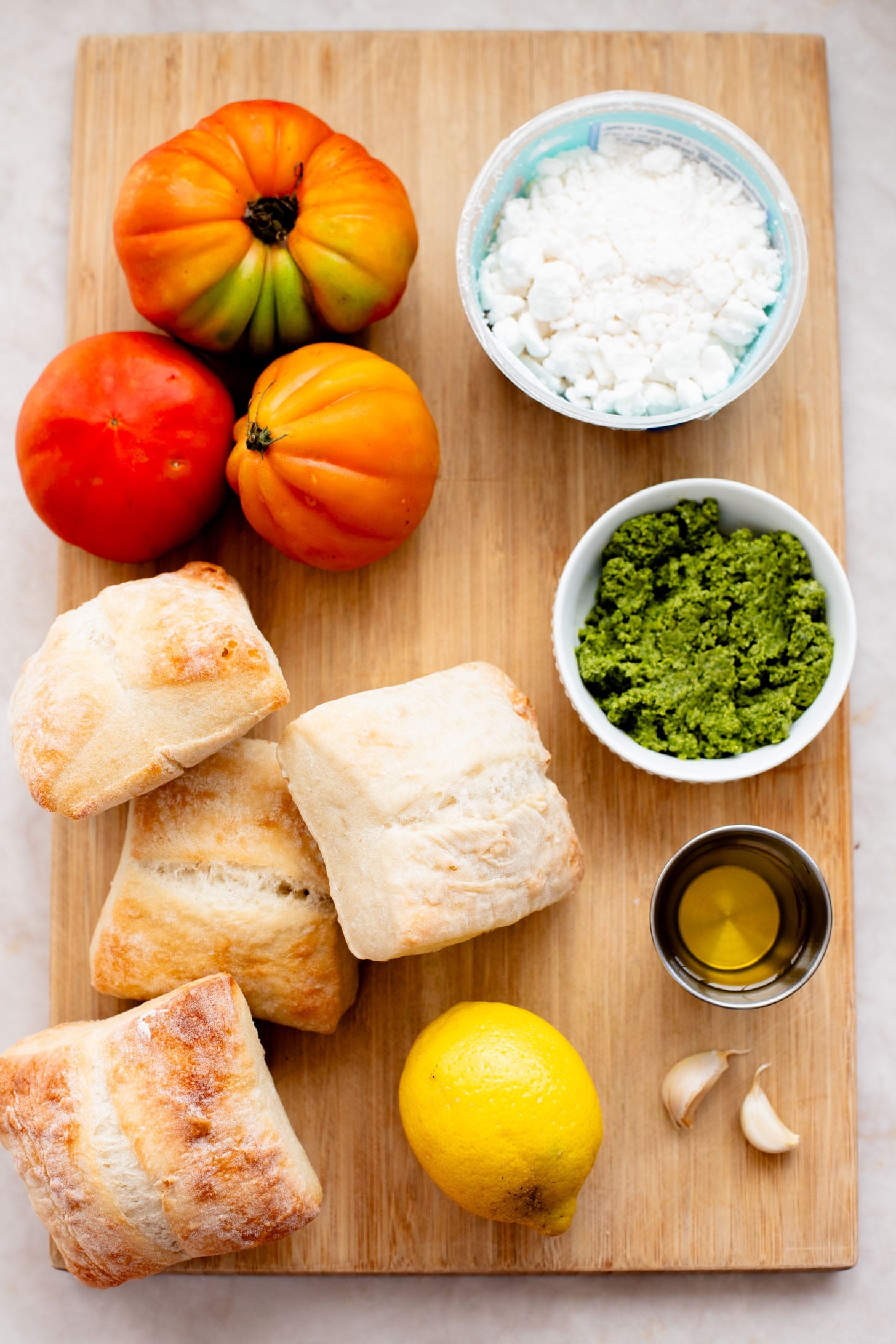 These Whipped Feta & Pesto Tomato Sandwiches are the perfect summer sammie! Made with dairy-free feta - the perfect way to use up summer tomatoes | ThisSavoryVegan.com