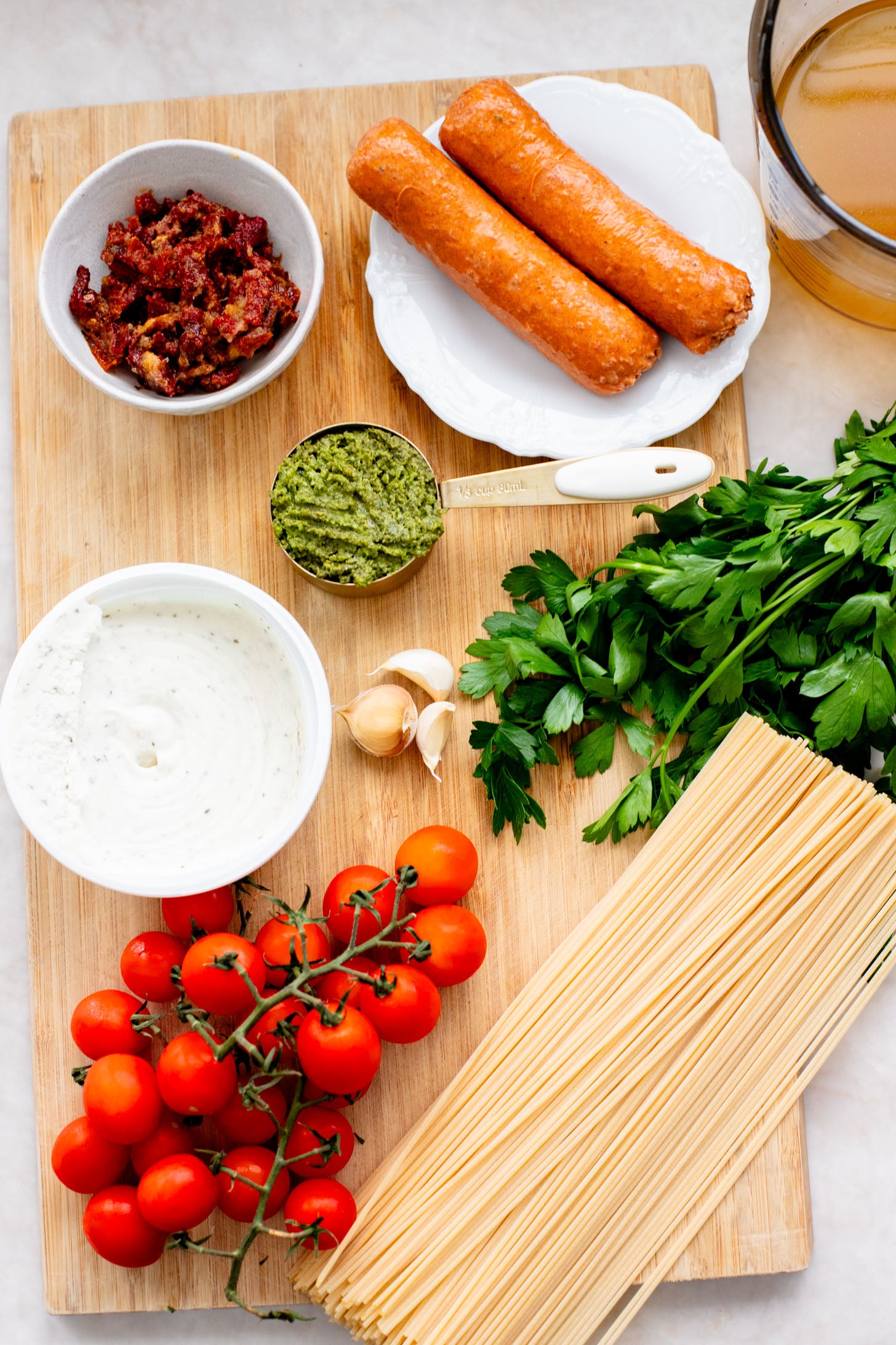 This One-Pot Vegan Sausage & Pesto Spaghetti is the perfect family dinner! Quick, easy and you only have one pan to wash | ThisSavoryVegan.com