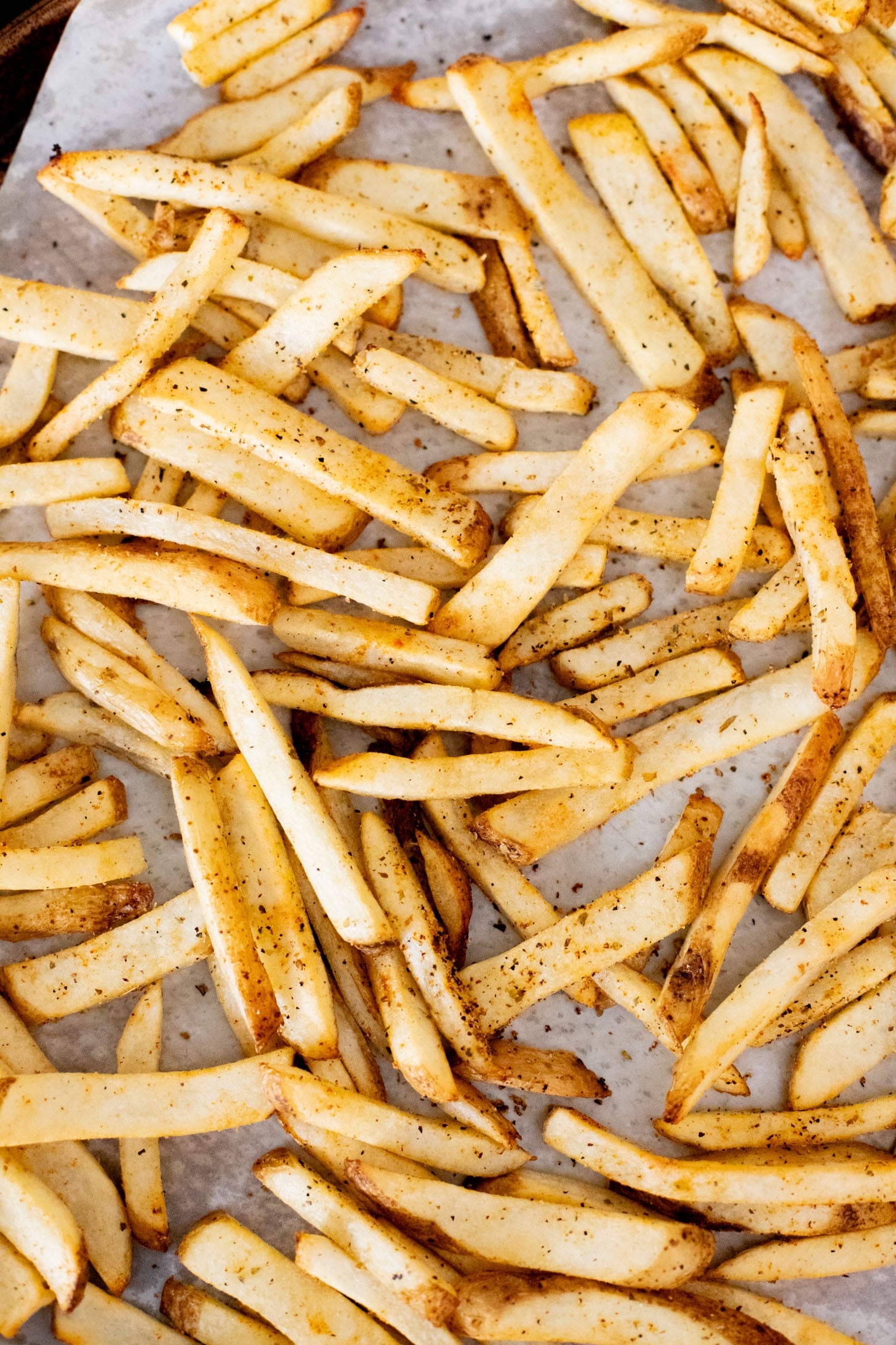 These Seasoned Fries with Feta Chive Dip is the ultimate vegan party snack. Frozen fries are seasoned and then served with the BEST vegan chive dip | ThisSavoryVegan.com