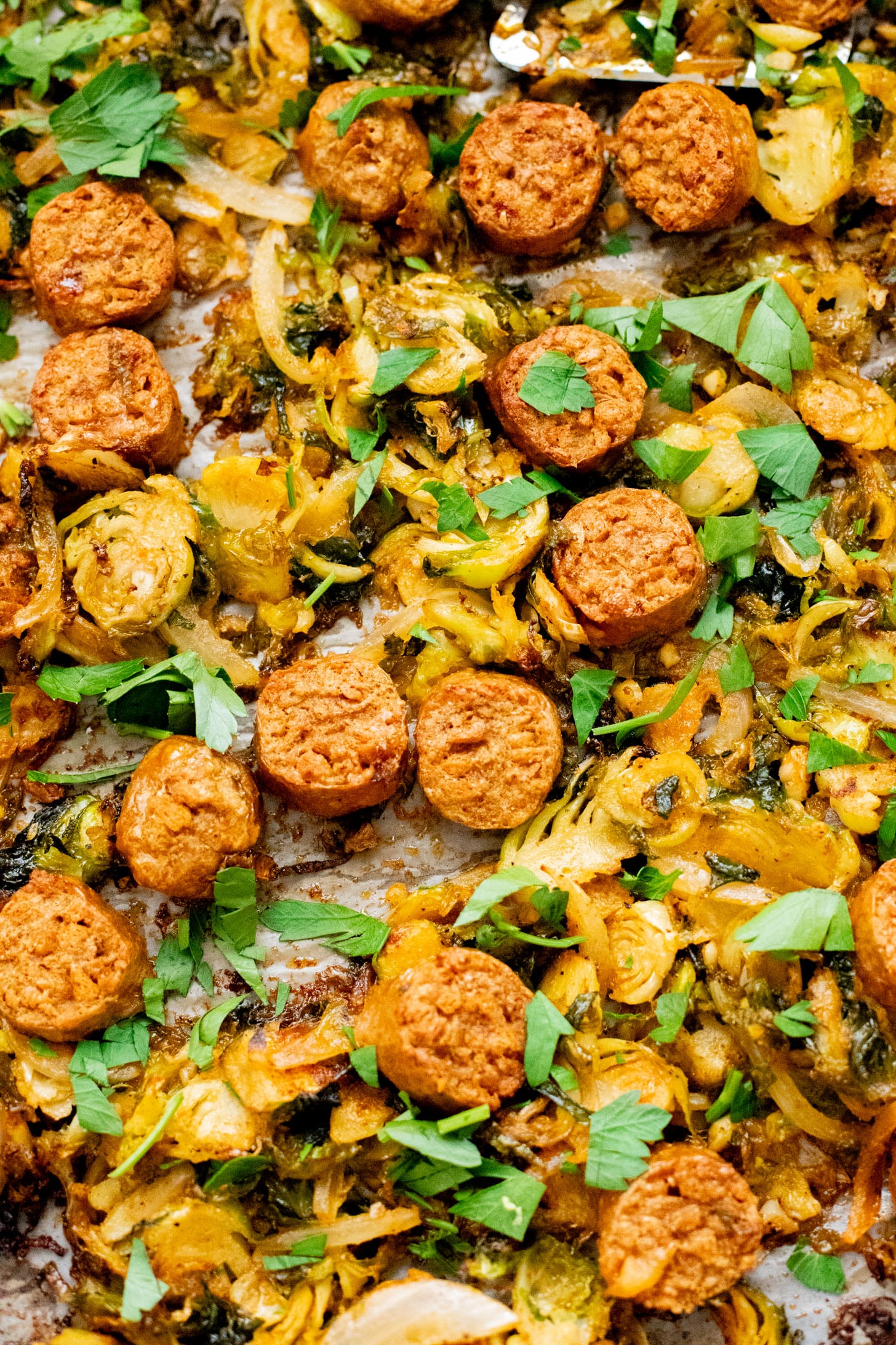 This Sheet Pan Brussels Sprouts & Sausage recipe is the perfect vegan fall dinner. The brussels sprouts are crispy, the vegan sausage is charred and delicious | ThisSavoryVegan.com