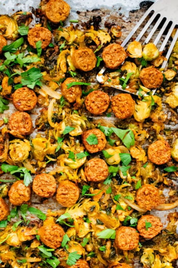 This Sheet Pan Brussels Sprouts & Sausage recipe is the perfect vegan fall dinner. The brussels sprouts are crispy, the vegan sausage is charred and delicious | ThisSavoryVegan.com