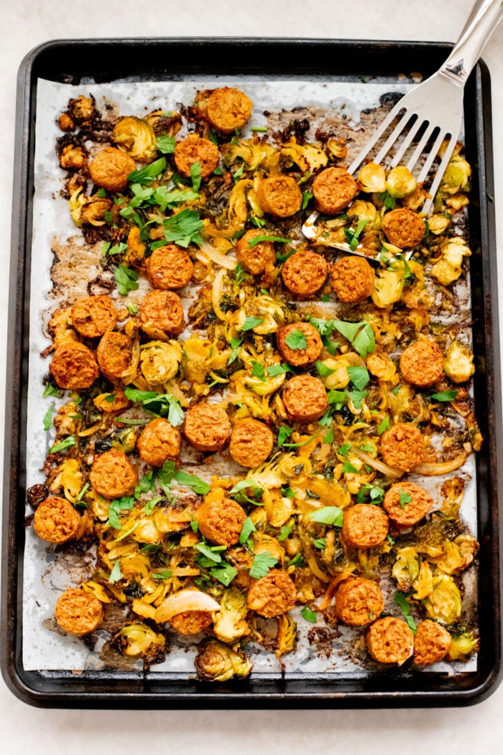 This Sheet Pan Brussels Sprouts & Sausage recipe is the perfect vegan fall dinner. The brussels sprouts are crispy, the vegan sausage is charred and delicious | ThisSavoryVegan.com