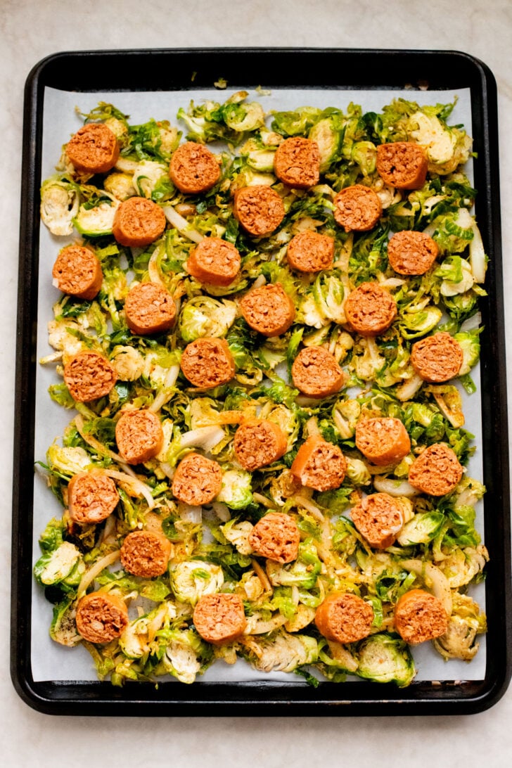 This Sheet Pan Brussels Sprouts & Sausage recipe is the perfect vegan fall dinner. The brussels sprouts are crispy, the vegan sausage is charred and delicious | ThisSavoryVegan.com