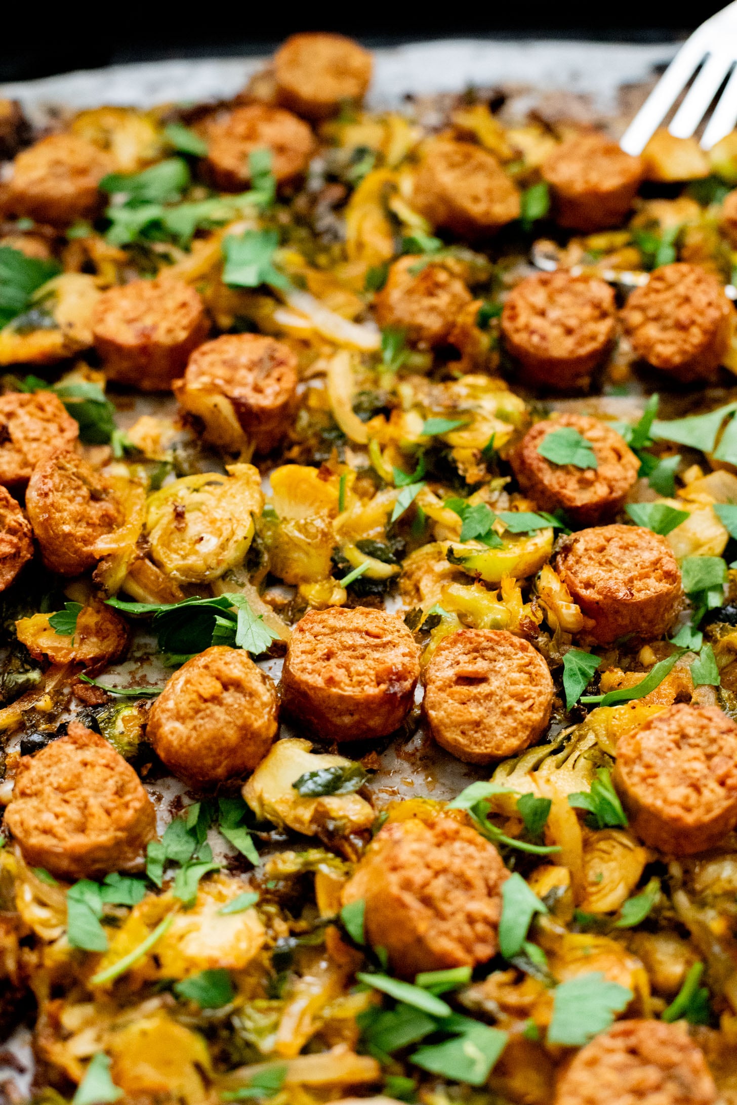This Sheet Pan Brussels Sprouts & Sausage recipe is the perfect vegan fall dinner. The brussels sprouts are crispy, the vegan sausage is charred and delicious | ThisSavoryVegan.com