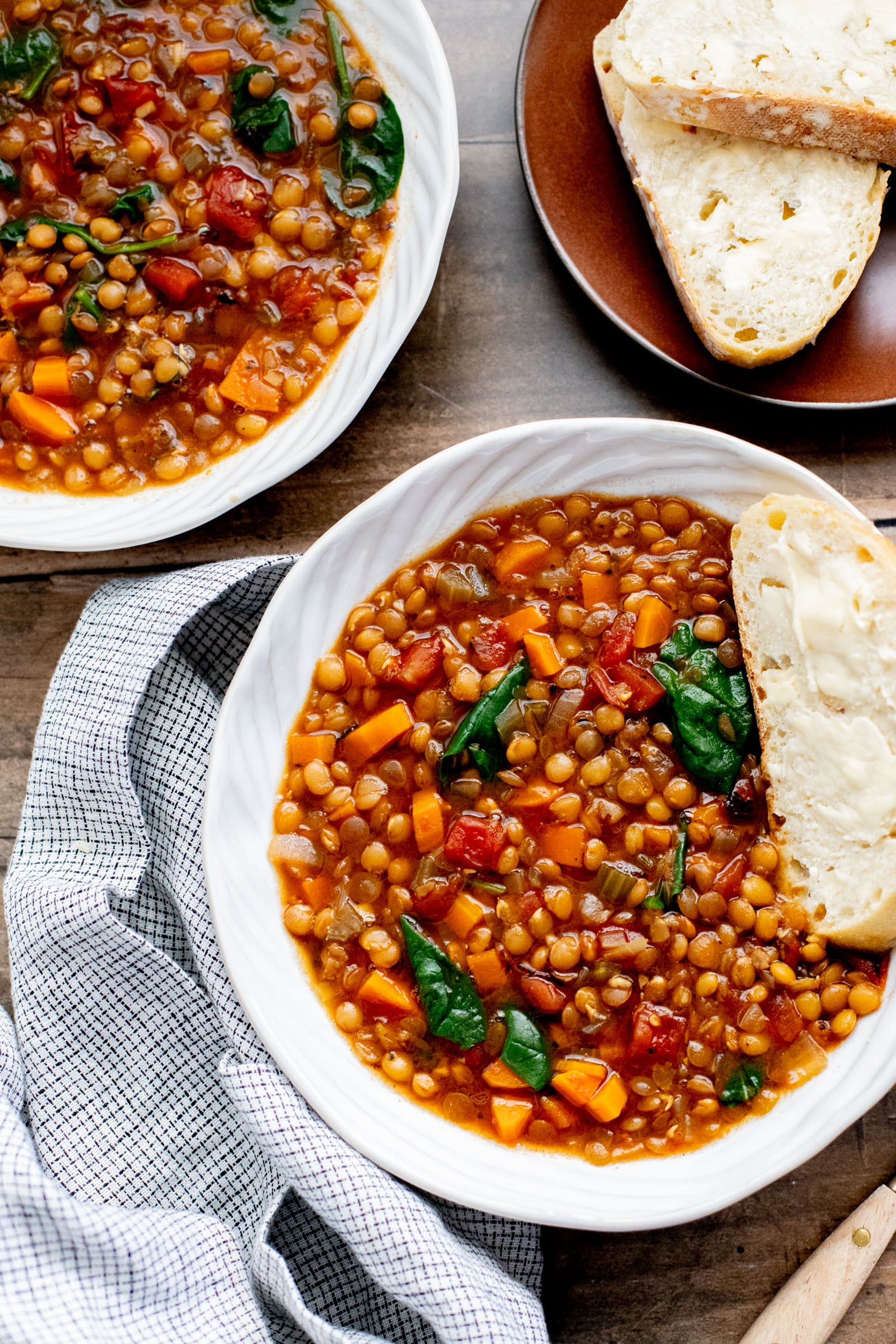 This Slow Cooker Lentil & Veggie Soup is hearty, easy and delicious. Packed with veggies & simmered all day in the most delicious vegan broth | ThisSavoryVegan.com
