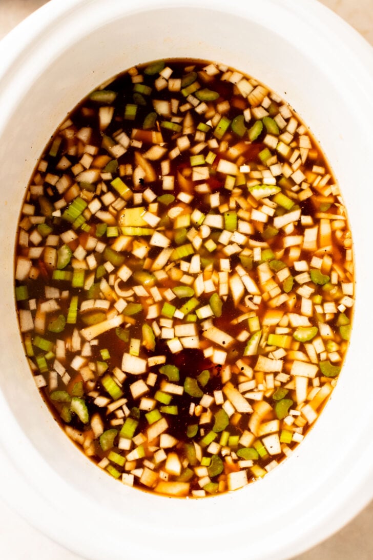 This Slow Cooker Lentil & Veggie Soup is hearty, easy and delicious. Packed with veggies & simmered all day in the most delicious vegan broth | ThisSavoryVegan.com