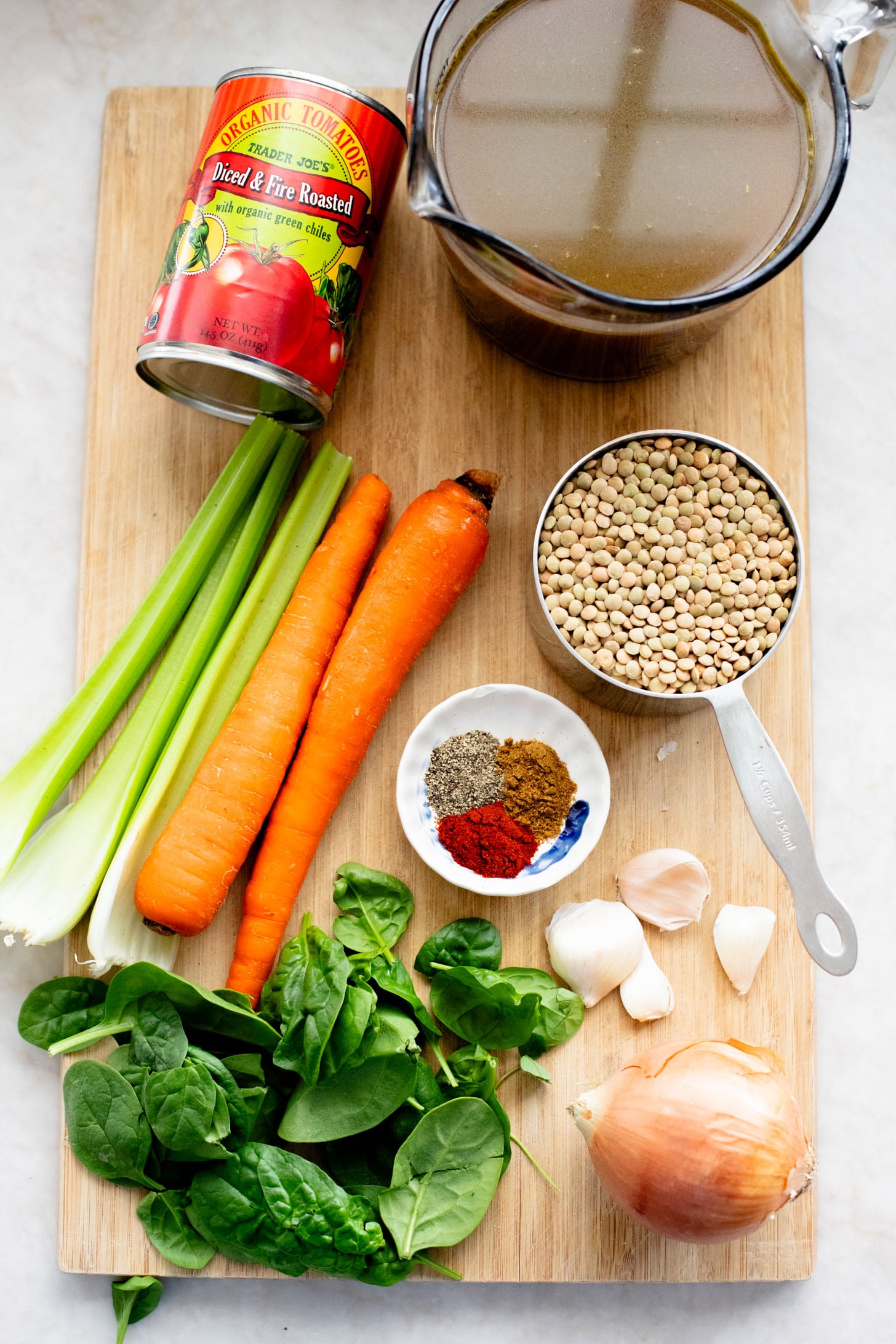 This Slow Cooker Lentil & Veggie Soup is hearty, easy and delicious. Packed with veggies & simmered all day in the most delicious vegan broth | ThisSavoryVegan.com
