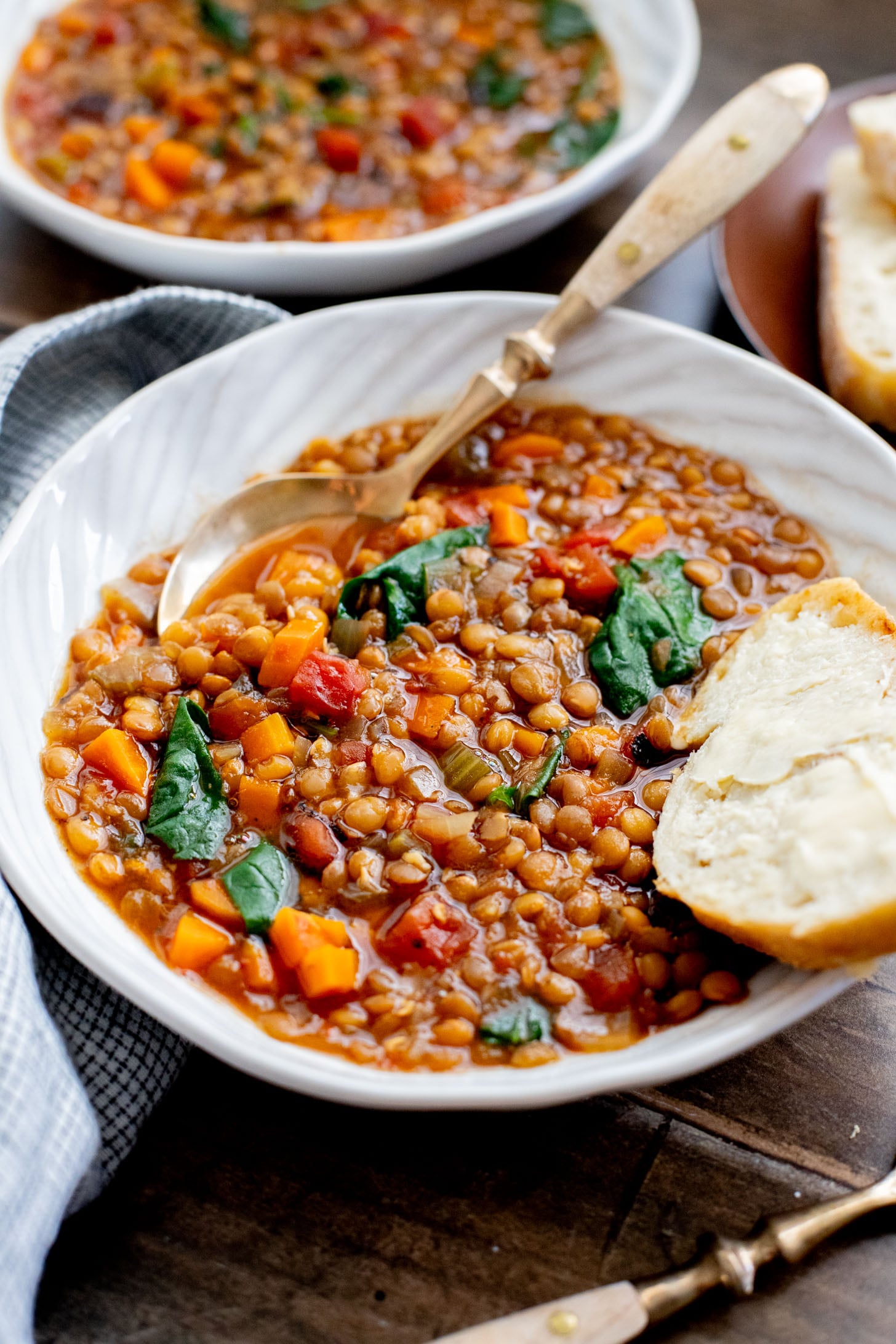 This Slow Cooker Lentil & Veggie Soup is hearty, easy and delicious. Packed with veggies & simmered all day in the most delicious vegan broth | ThisSavoryVegan.com