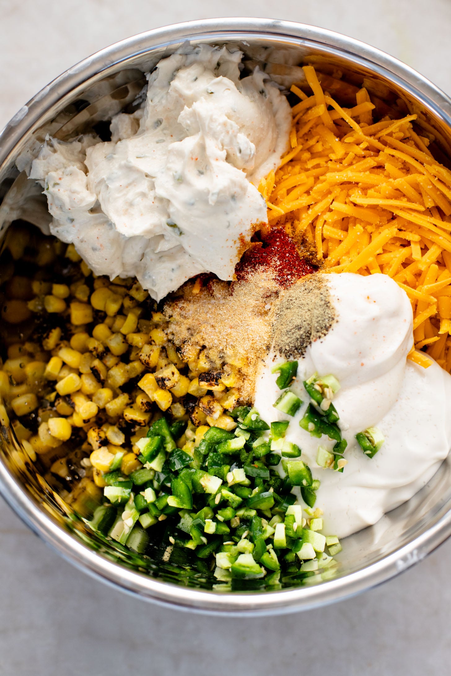 This Spicy Cheesy Corn Dip is the perfect dairy-free game day snack! Creamy, delicious and has the perfect kick. Great with chips | ThisSavoryVegan.com