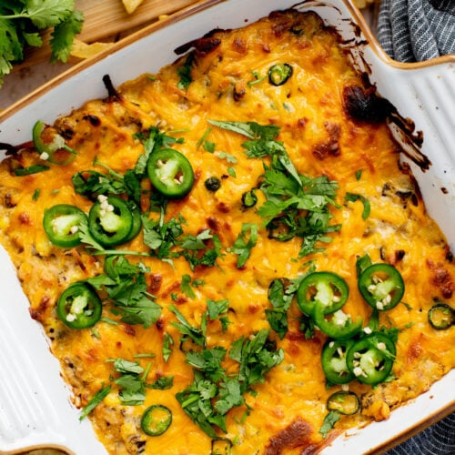 This Spicy Cheesy Corn Dip is the perfect dairy-free game day snack! Creamy, delicious and has the perfect kick. Great with chips | ThisSavoryVegan.com