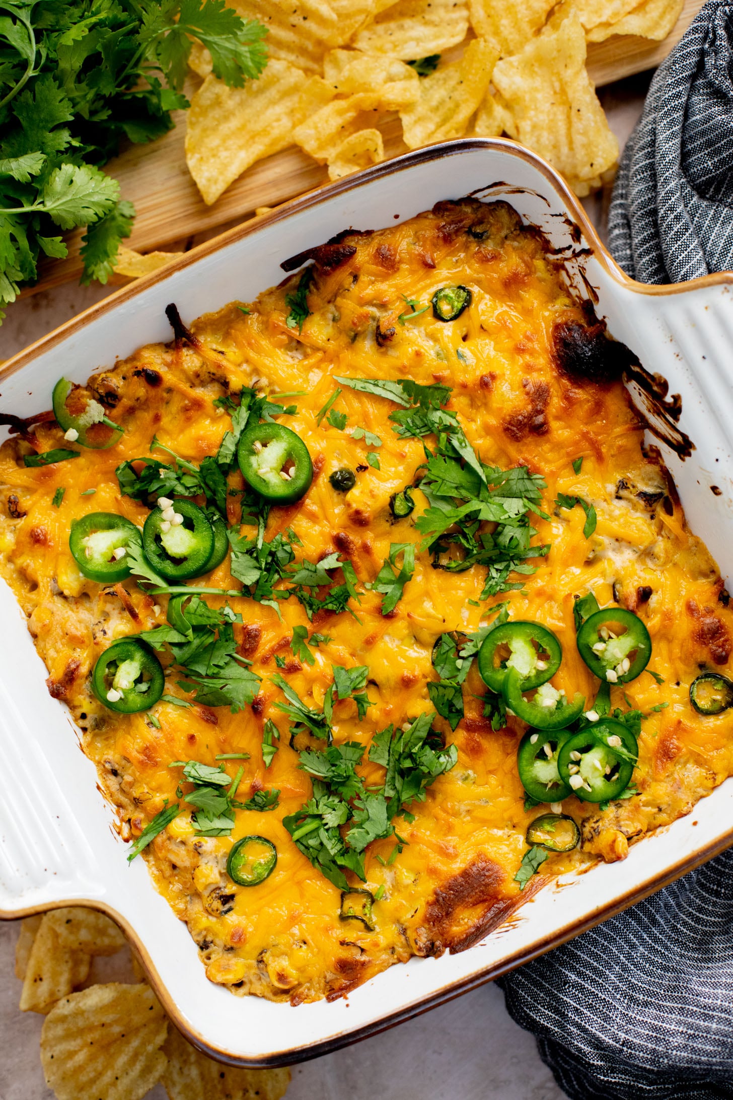 This Spicy Cheesy Corn Dip is the perfect dairy-free game day snack! Creamy, delicious and has the perfect kick. Great with chips | ThisSavoryVegan.com