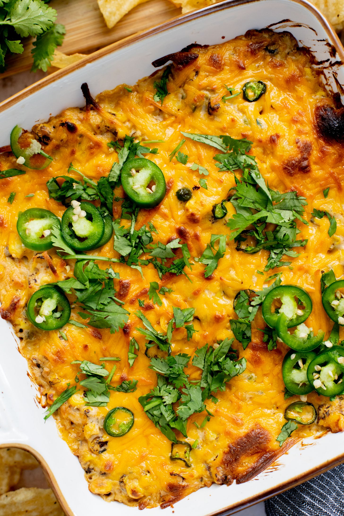 This Spicy Cheesy Corn Dip is the perfect dairy-free game day snack! Creamy, delicious and has the perfect kick. Great with chips | ThisSavoryVegan.com