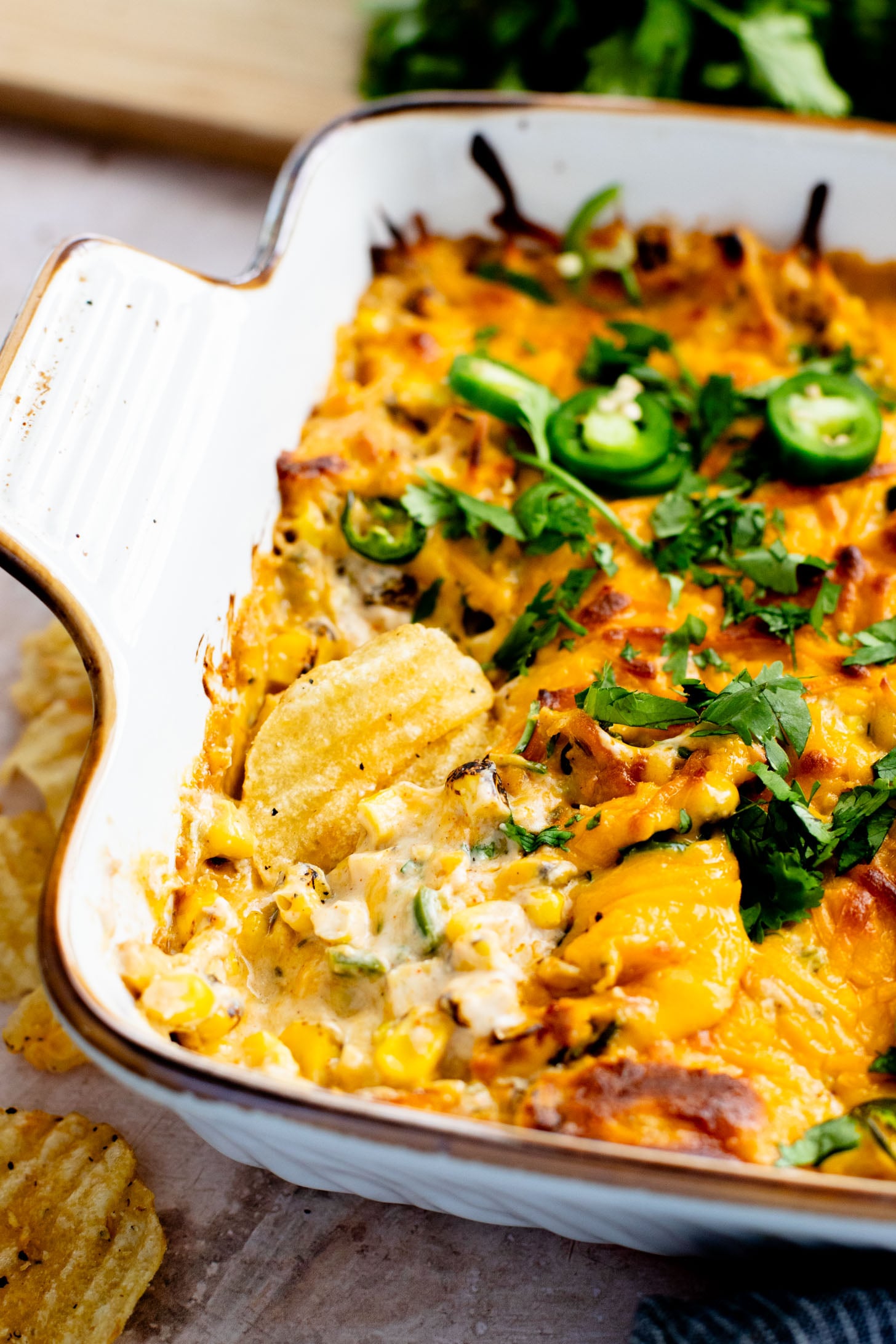 This Spicy Cheesy Corn Dip is the perfect dairy-free game day snack! Creamy, delicious and has the perfect kick. Great with chips | ThisSavoryVegan.com