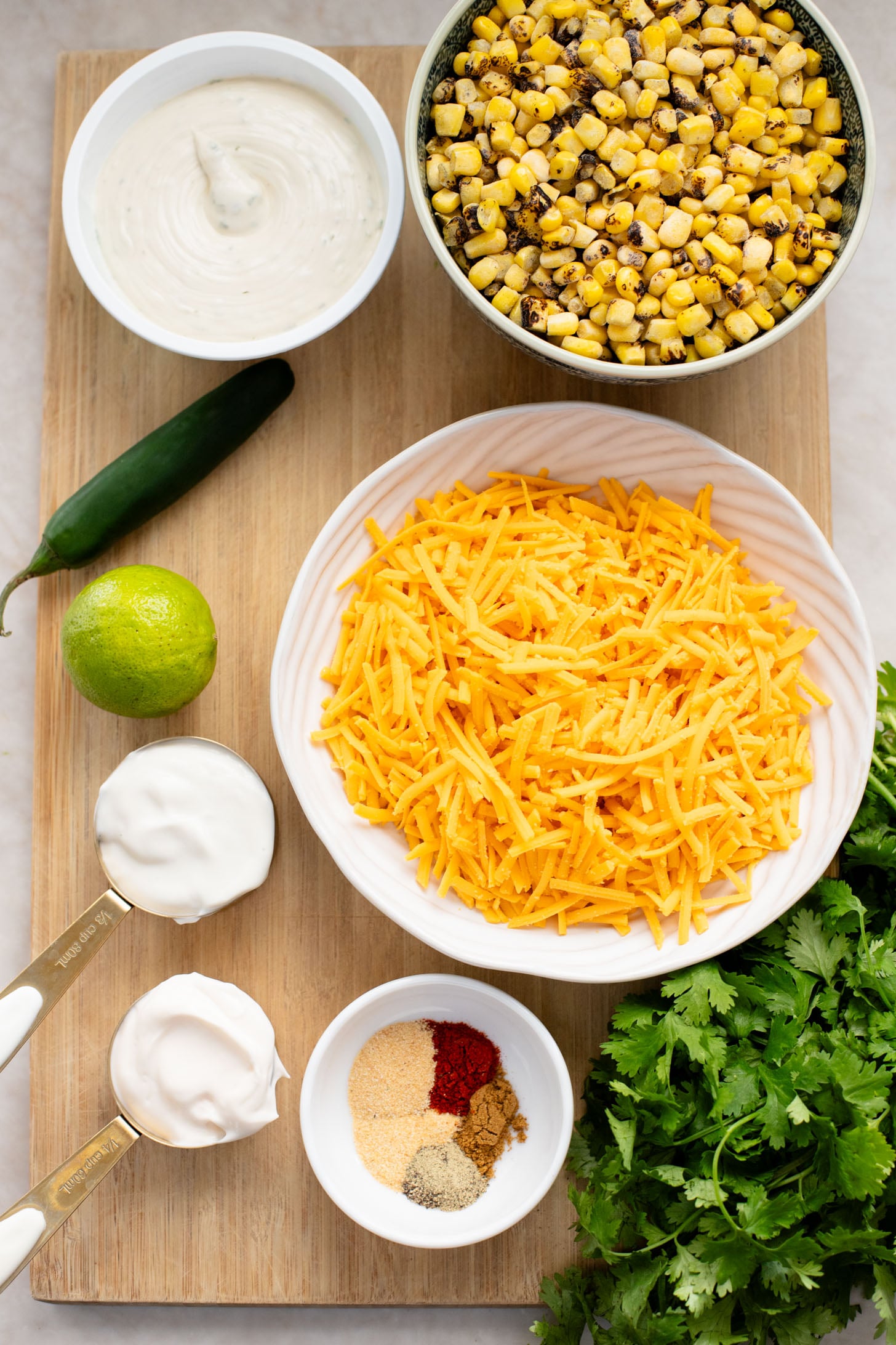 This Spicy Cheesy Corn Dip is the perfect dairy-free game day snack! Creamy, delicious and has the perfect kick. Great with chips | ThisSavoryVegan.com