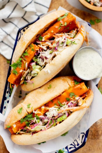 These Trader Joe's Buffalo Tofu Sandwiches are filled with crispy buffalo tofu and the most delicious vegan slaw! The perfect vegan sammie | ThisSavoryVegan.com