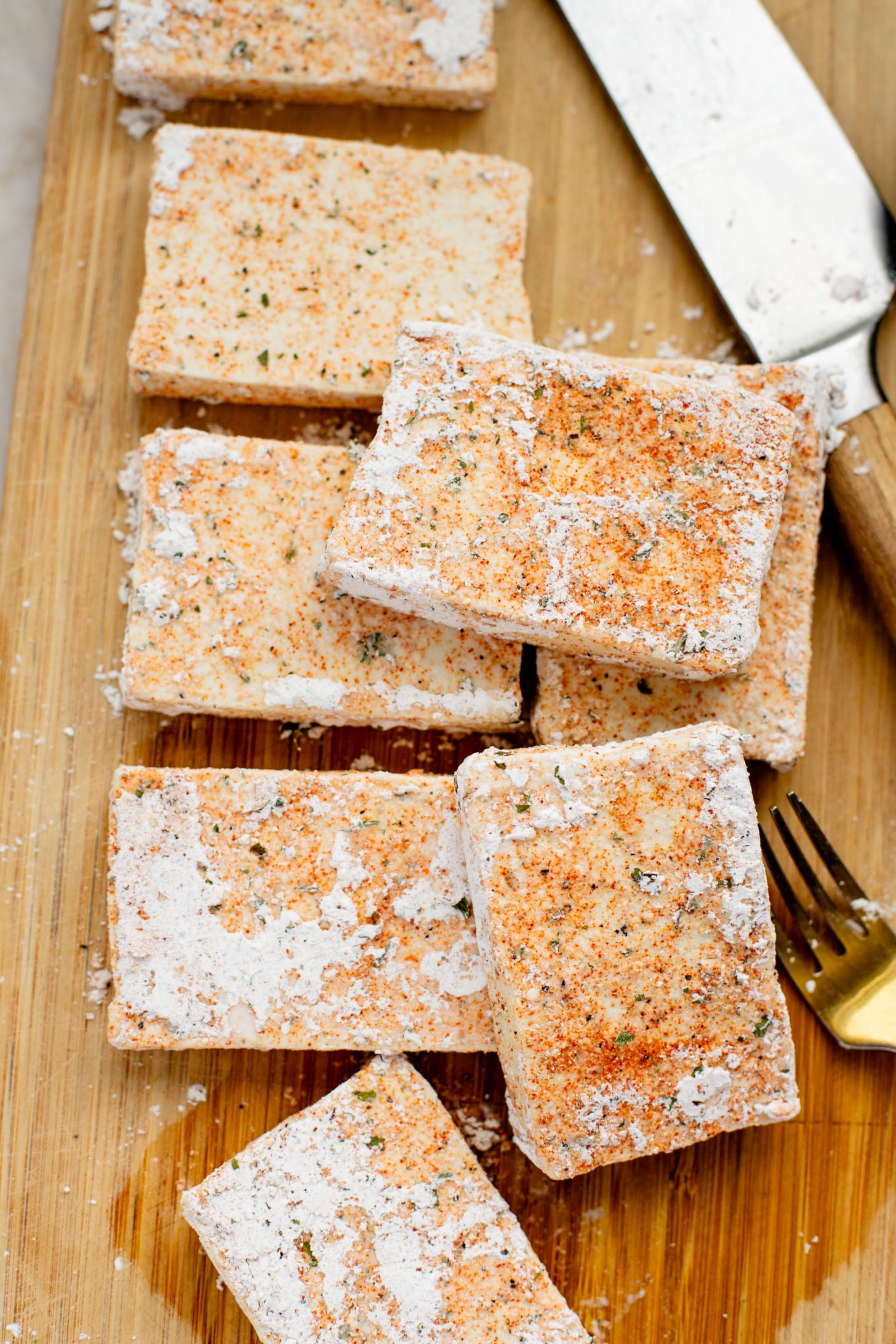These Trader Joe's Buffalo Tofu Sandwiches are filled with crispy buffalo tofu and the most delicious vegan slaw! The perfect vegan sammie | ThisSavoryVegan.com