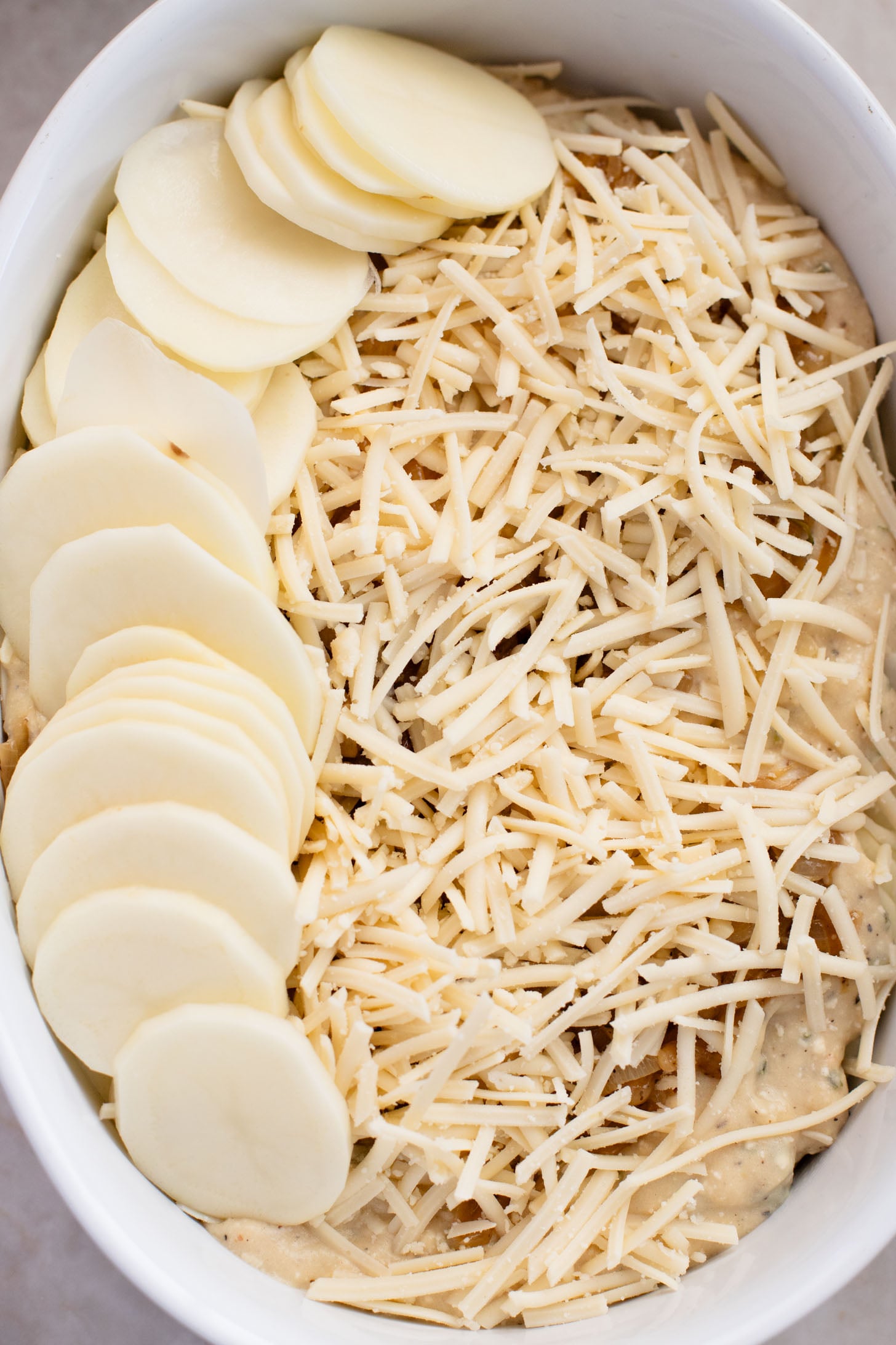 These French Onion Scalloped Potatoes are the perfect vegan holiday side dish. Dairy-free, but you'd never know it | ThisSavoryVegan.com