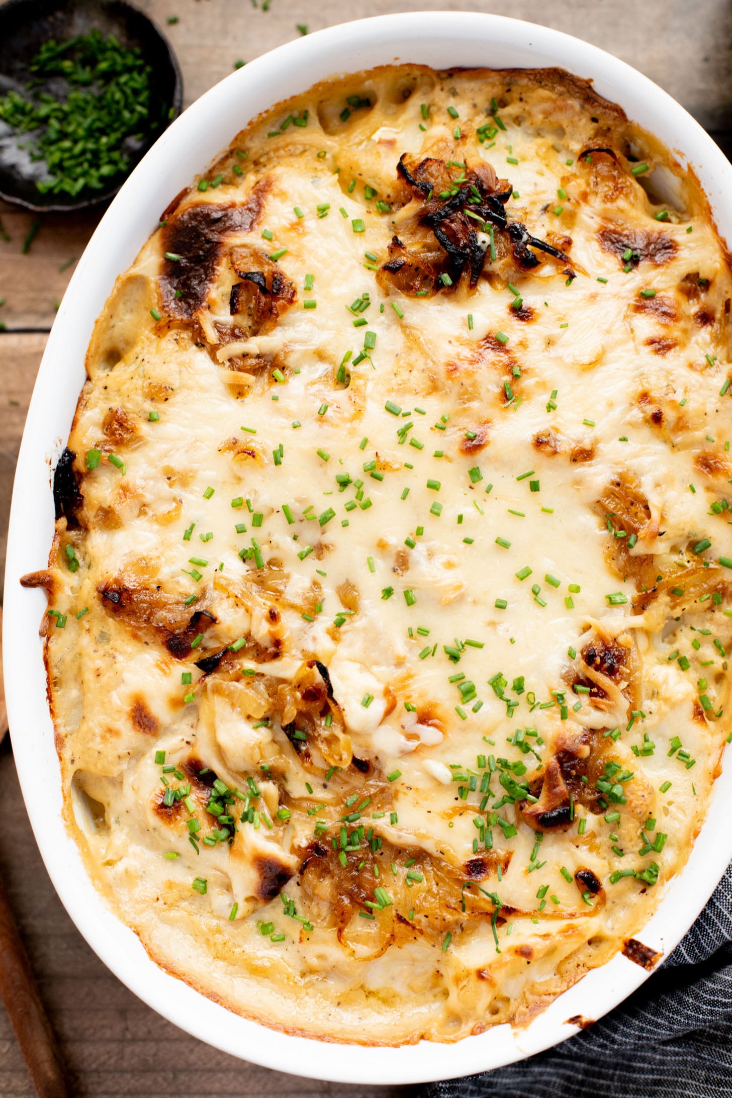 These French Onion Scalloped Potatoes are the perfect vegan holiday side dish. Dairy-free, but you'd never know it | ThisSavoryVegan.com
