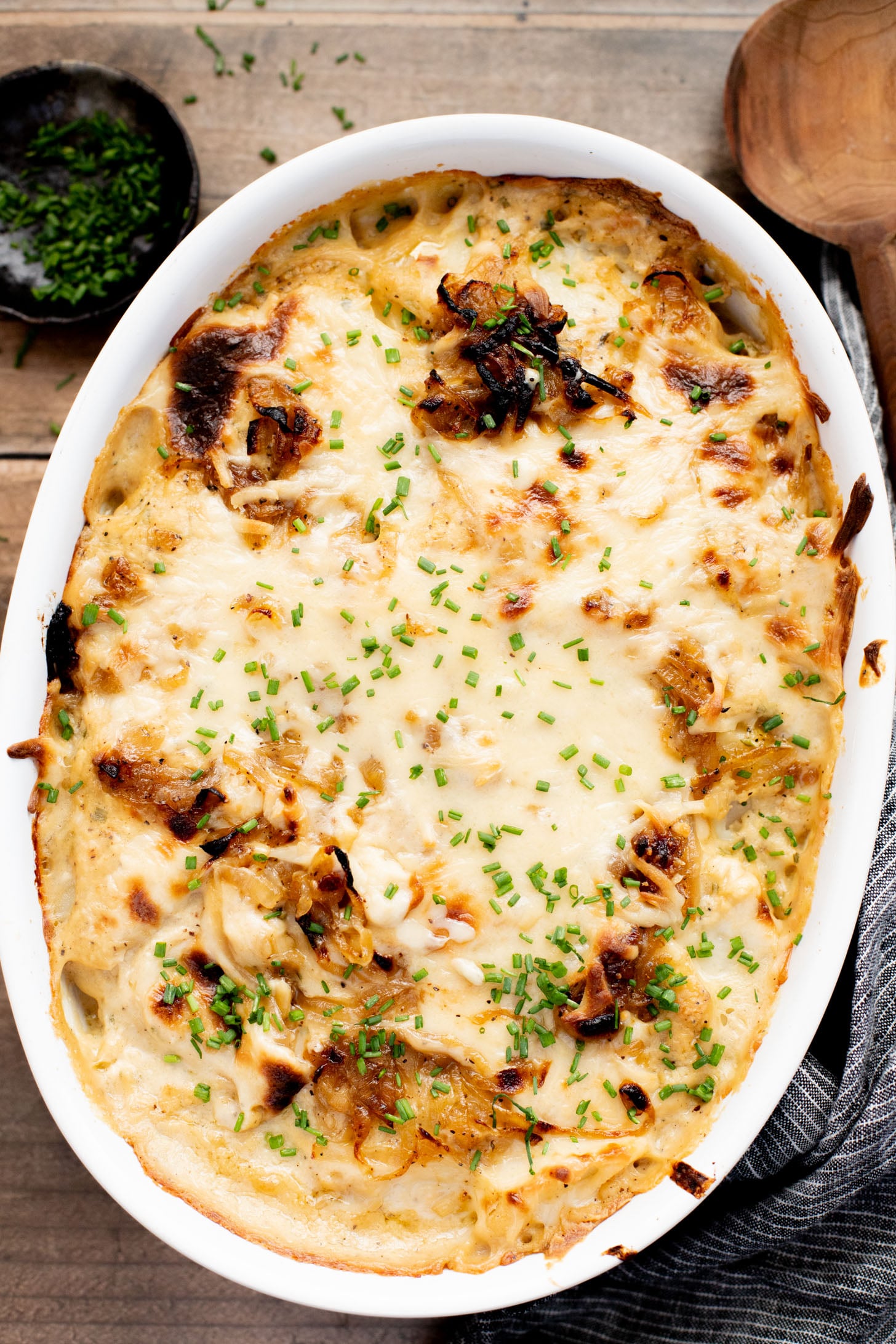 These French Onion Scalloped Potatoes are the perfect vegan holiday side dish. Dairy-free, but you'd never know it | ThisSavoryVegan.com