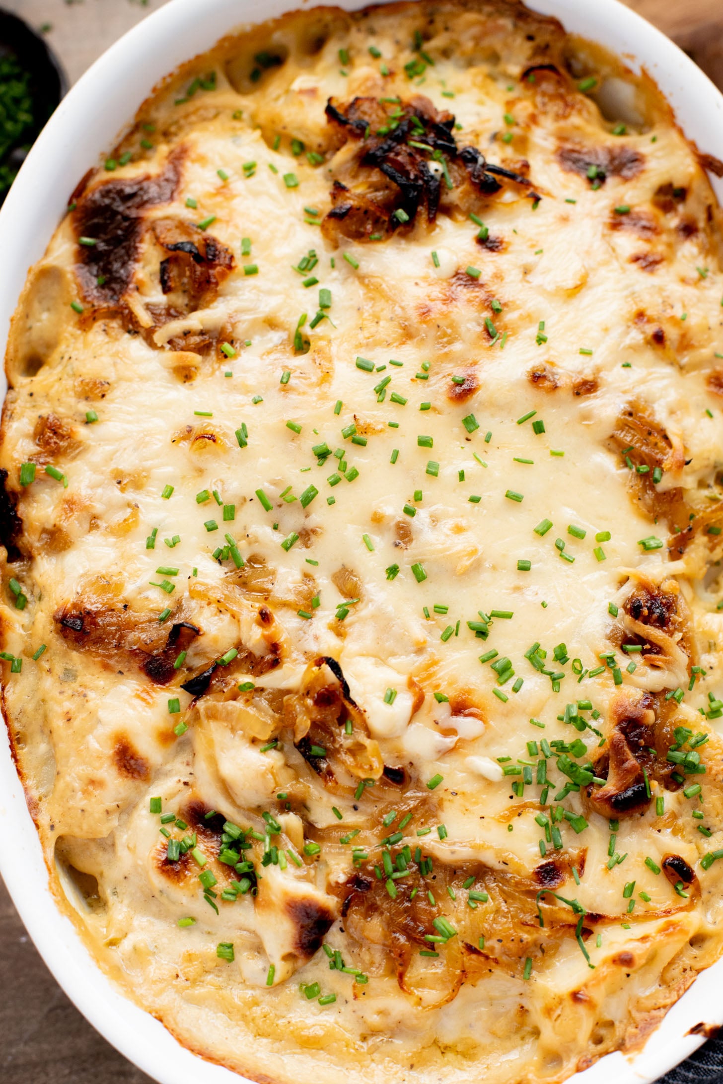 These French Onion Scalloped Potatoes are the perfect vegan holiday side dish. Dairy-free, but you'd never know it | ThisSavoryVegan.com