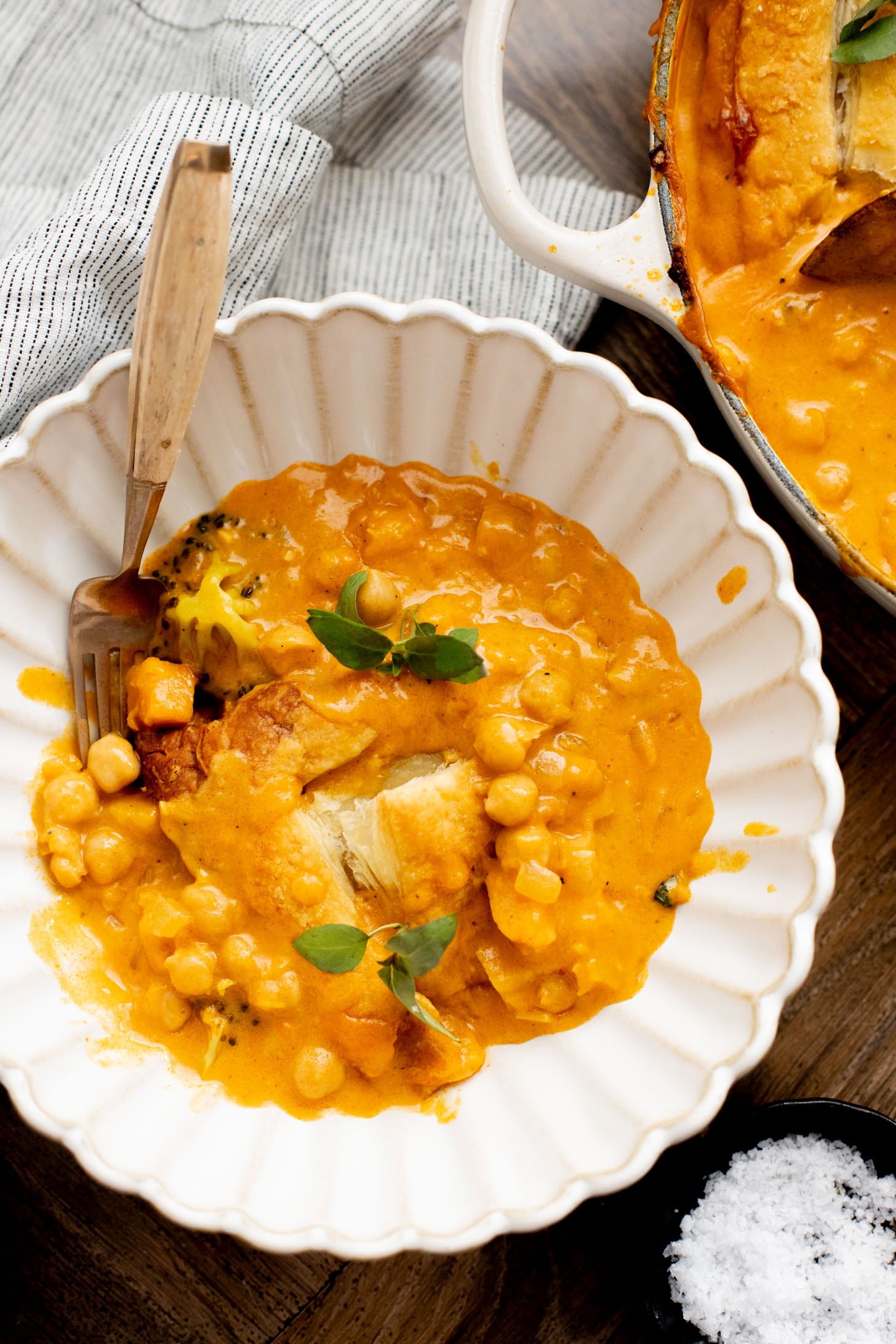 This Red Curry Butternut Squash Pot Pie is veggie-packed comfort food. Tender veggies, chickpeas and a delicious coconut curry sauce | ThisSavoryVegan.com