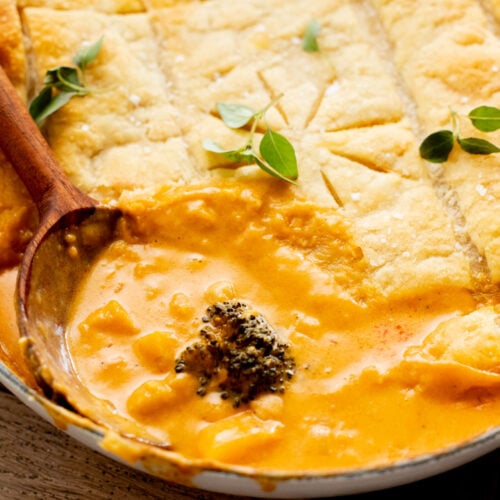 This Red Curry Butternut Squash Pot Pie is veggie-packed comfort food. Tender veggies, chickpeas and a delicious coconut curry sauce | ThisSavoryVegan.com