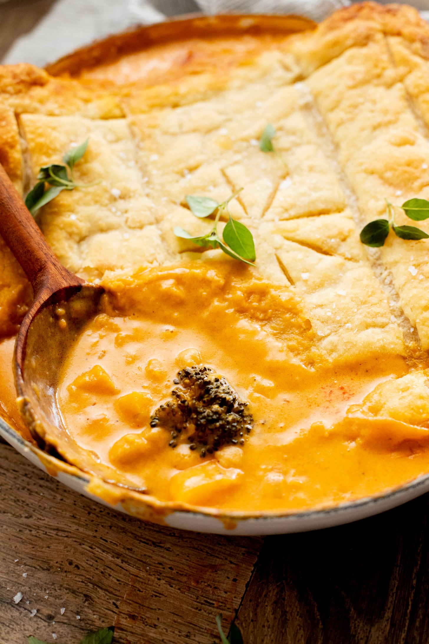 This Red Curry Butternut Squash Pot Pie is veggie-packed comfort food. Tender veggies, chickpeas and a delicious coconut curry sauce | ThisSavoryVegan.com