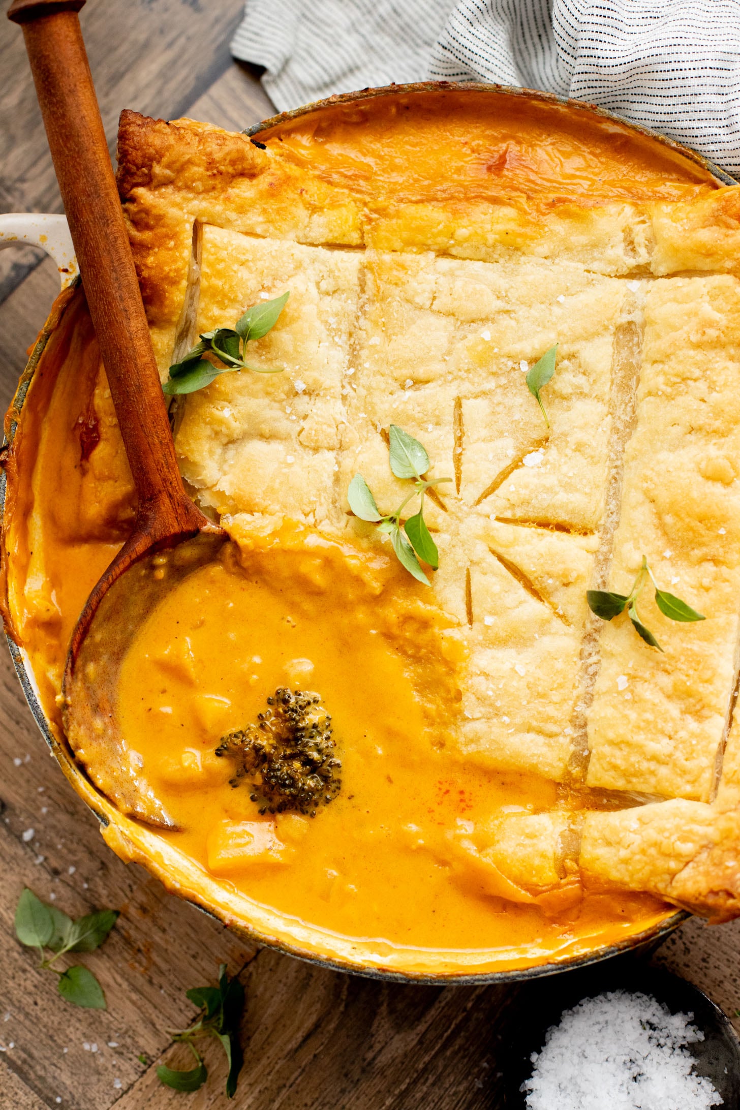 This Red Curry Butternut Squash Pot Pie is veggie-packed comfort food. Tender veggies, chickpeas and a delicious coconut curry sauce | ThisSavoryVegan.com