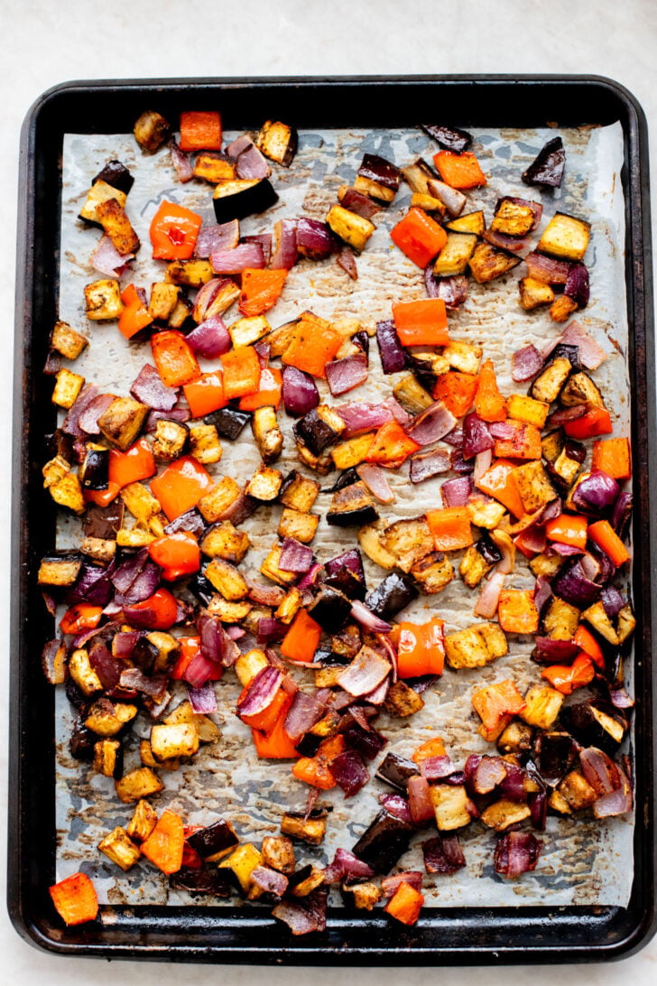 This Roasted Veggie Lentil Salad is filled with eggplant, bell pepper, onions, fresh herbs, lentils, vegan feta & a light, tangy dressing | ThisSavoryVegan.com