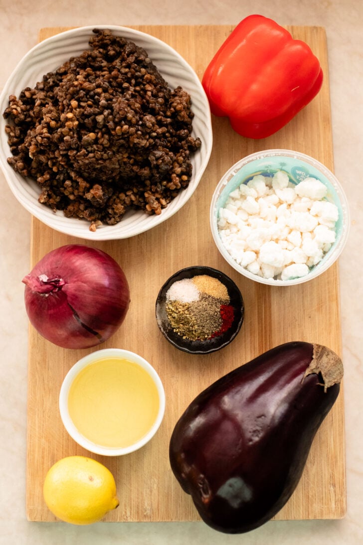 This Roasted Veggie Lentil Salad is filled with eggplant, bell pepper, onions, fresh herbs, lentils, vegan feta & a light, tangy dressing | ThisSavoryVegan.com