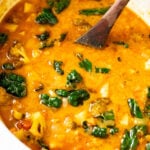 This Slow Cooker Red Curry Potato Soup is packed with veggies and the most delicious coconut broth. The perfect dairy-free soup | ThisSavoryVegan.com