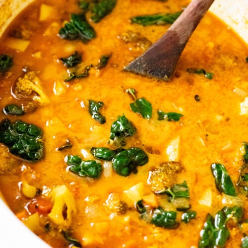 This Slow Cooker Red Curry Potato Soup is packed with veggies and the most delicious coconut broth. The perfect dairy-free soup | ThisSavoryVegan.com