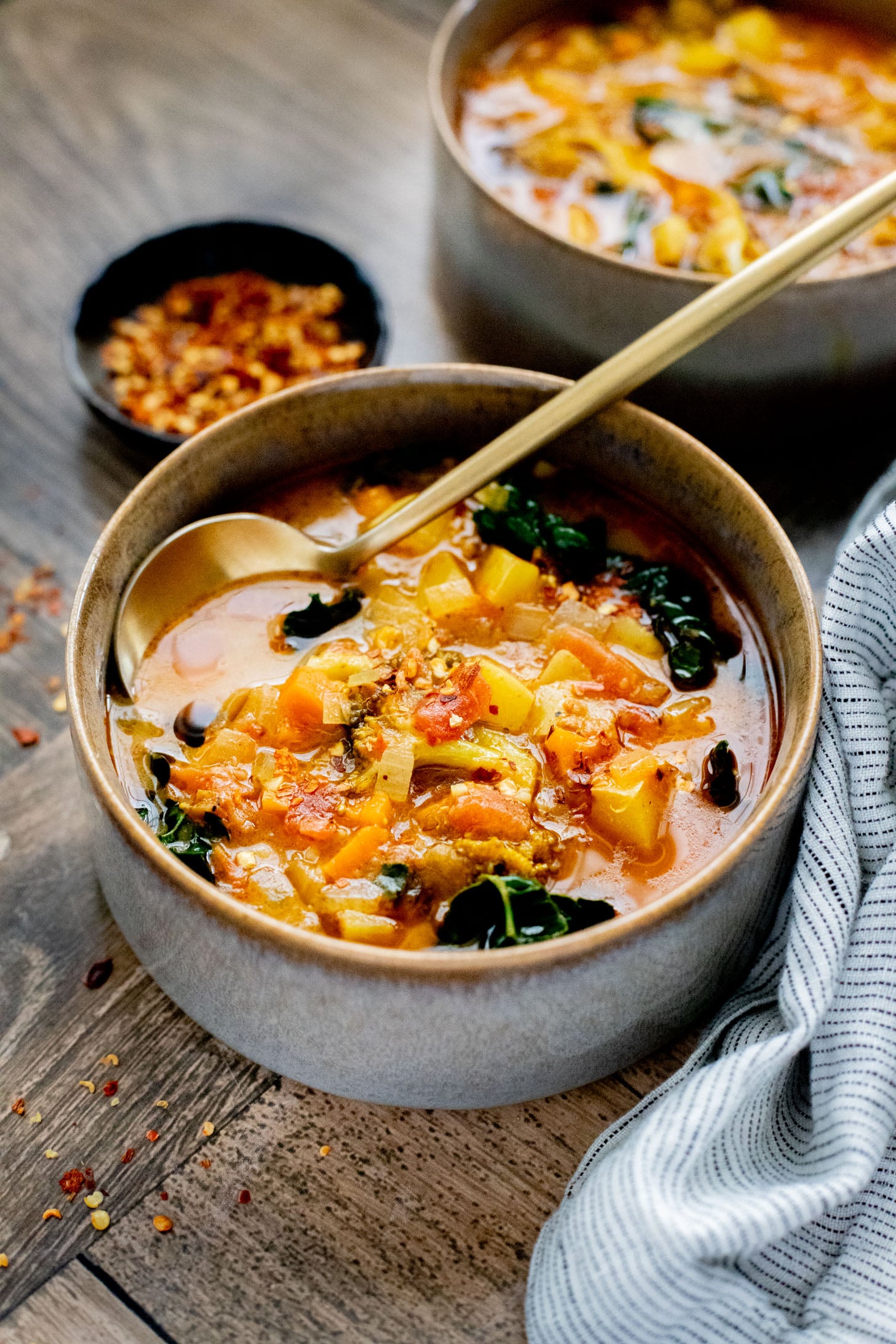 This Slow Cooker Red Curry Potato Soup is packed with veggies and the most delicious coconut broth. The perfect dairy-free soup | ThisSavoryVegan.com