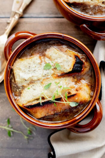 Rich, savory and totally delicious, this Vegan French Onion Soup is going to be your go-to comforting soup recipe | ThisSavoryVegan.com