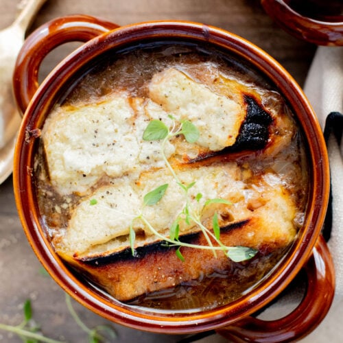 Rich, savory and totally delicious, this Vegan French Onion Soup is going to be your go-to comforting soup recipe | ThisSavoryVegan.com