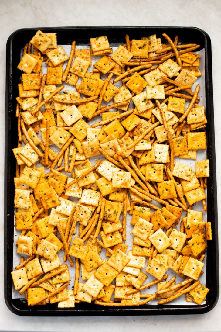 This Vegan Holiday Snack Mix is so addicting. Made with dairy-free cheese crackers, pretzels and the best seasoning blend | ThisSavoryVegan.com