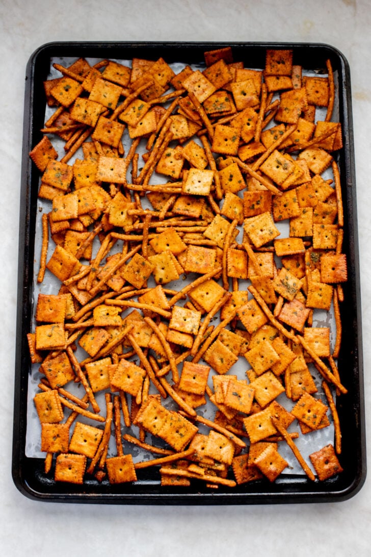 This Vegan Holiday Snack Mix is so addicting. Made with dairy-free cheese crackers, pretzels and the best seasoning blend | ThisSavoryVegan.com