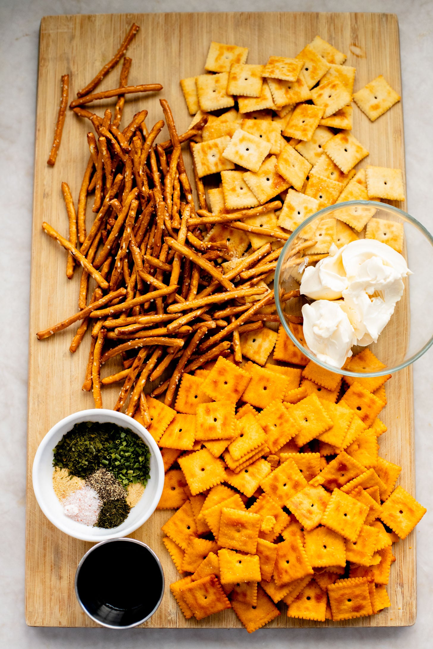This Vegan Holiday Snack Mix is so addicting. Made with dairy-free cheese crackers, pretzels and the best seasoning blend | ThisSavoryVegan.com